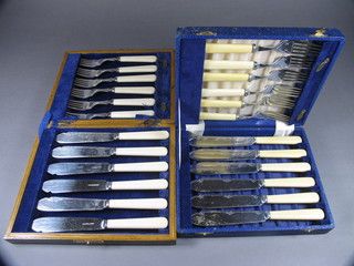 2 sets of 6 silver plated fish knives and forks, cased