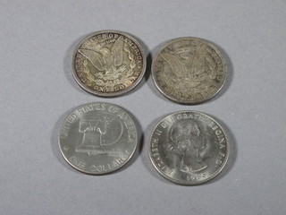 2 American dollars 1878 and 1879, a 1976 American dollar and a 1965 Churchill crown