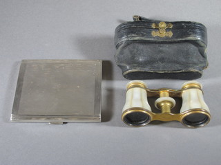 An engraved silver cigarette case with engine turned decoration Birmingham 1949, 5ozs together with a pair of gilt metal and  mother of pearl mounted opera glasses