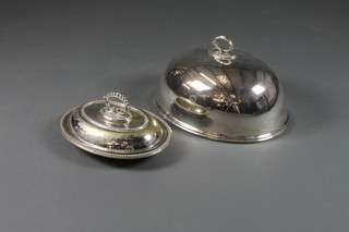 An oval silver plated meat cover by Mappin & Webb 16" and an  oval silver plated entree dish and cover 14" and a pewter hip  flask