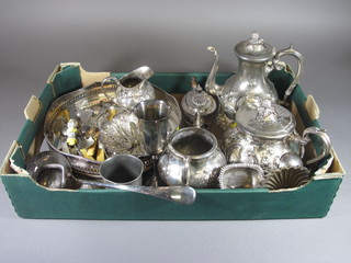 A circular silver plated engraved tea tray, a Britannia metal  coffee pot and other plated items