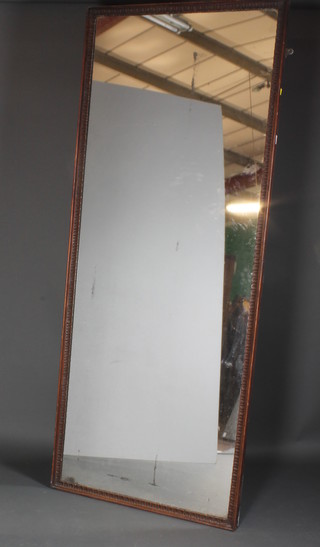 A late 19th Century French walnut Pier glass having egg and dart carved frame with acanthus leaf spandrels 82"h x 34"w