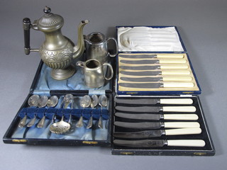 A Britannia metal coffee pot 7", 2 small hotelware cream jugs, 2 cased sets of tea knives, etc