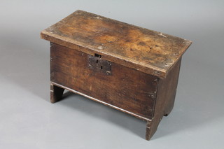 A 17th Century 6 plank oak coffer with hinged top raised on end stiles, altered 18"h x 27"w x 14"d