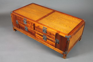 A Chinese style hardwood opium table, metal mounted fitted with  an arrangement of 2 cupboard doors and 4 small drawers, raised  on shaped feet 16"h x 47"w x 24"d