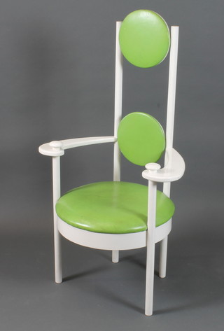 A 20th Century modernist elbow chair, having lime green rexine upholstered back and seat on turned legs