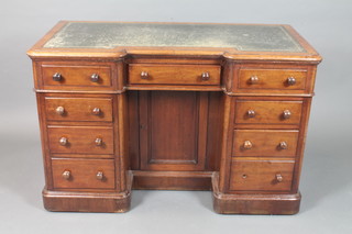 A Victorian mahogany inverted breakfront pedestal desk, having gilt tooled leather skiver to top, fitted an arrangement of 9 small  drawers raised on plinth base 31"h x 48"w x 25"d