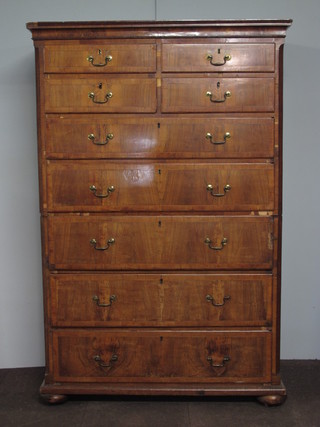 An early 18th Century walnut chest on chest having cavetto  moulded cornice above 4 short and 5 graduated long drawers,  flanked by chamfered corners, raised on later flattened bun feet  73.5"h x 49"w x 23"d