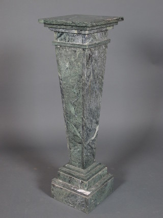 A green marble column having a square top raised on a tapered column, plinth base 39"h x 12"w x 12"d