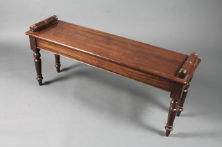 A William IV style mahogany window stool, raised on turned tapered legs and peg feet 18"h x 46"w x 13"d