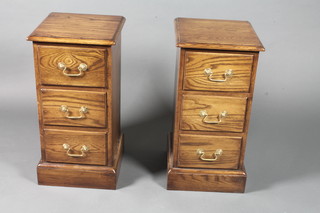 A pair of mid 18th Century style oak bedside chests of 3 drawers,  on plinth bases 27.5"h x 13"w x 13.5"d