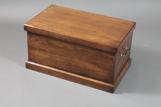 An 18th Century style oak blanket box with hinged lid, brass handles to ends, raised on plinth base 15"h x 28"w x 16.5"d