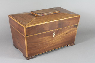 A Victorian mahogany tea caddy of sarcophagus form, satinwood  banded, the hinged top enclosing a mixing bowl flanked by 2  hinged canisters on block feet 7.5"h x 12"w x 7.5"d