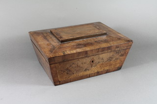 A 19th Century walnut work box of sarcophagus form, yew  wood crossbanded, the hinged top enclosing a fitted interior and  sewing items included 6"h x 12"w x 9.5"d