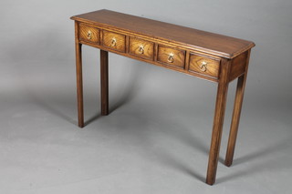 A late 17th Century style oak side table with moulded top above 5 small frieze drawers, raised on square chamfered legs 31"h x  42"w x 11.5"d