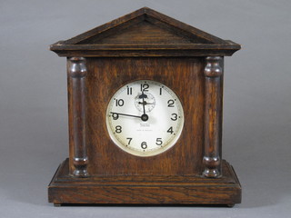 Tame Side, England, an early 20th Century oak alarm mantel  clock of architectural form having painted Arabic dial, set 8 day  movement chiming gong, 10"h x 10"w x 4"d
