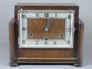 An Art Deco oak and chrome mantel clock having Arabic dial, 8 day movement with Whittington and Westminster chimes on 9  gongs 8.5"h x 10.5"w x 5"d