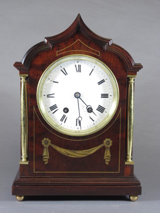 A late 19th Century mahogany bracket clock, cut brass inlaid, the case with pagoda top and polished brass column supports, raised  on bun feet having a Roman enamelled dial with 8 day  movement, chiming gong and signed Japy Freres 14.5"h x  10.25" x 5"