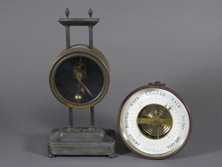 A late 19th Century drum cased aneroid barometer, having  Arabic enamelled dial 5"diam. together with a gravity timepiece with cylinder escapement and rack drive, raised on plinth base  and bun feet 10.5"h x 5"w x 3"d