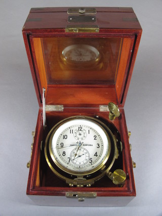 A mid 20th Century Russian 5 day marine chronometer, having Arabic dial with remaining power dial and subsidiary second dial,  housed within a brass mounted stained beechwood case 8"h x  7.5"w x 7.5"d  ILLUSTRATED