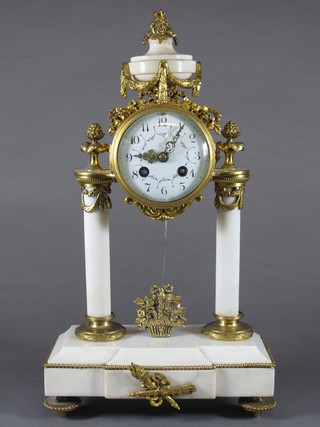 A mid 19th Century French Ormolu and white marble pendule du portique, having a foliate painted Arabic dial with breguet  numerals, set within a drum case with 8 day cylinder movement  with count wheel strike on bell, the plinth base centred with  trophies in satire, on toupee feet, 16"h x 9.5"w x 4.5"d