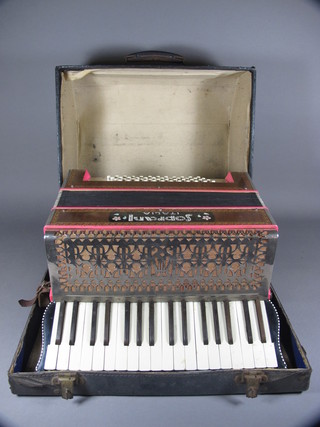 A Soprani accordion with 71 buttons, complete with carrying  case