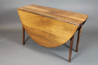 A George III mahogany drop leaf cottage dining table, raised on  turned tapered legs, pad feet, 29"h x 46"l