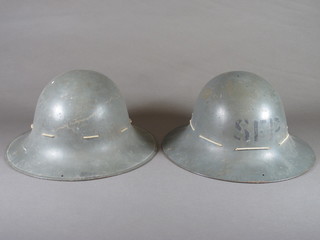 A pair of WWII fire watcher's helmets