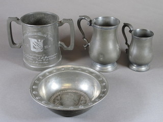 A Victorian pewter twin handled loving cup marked Exeter  College Made Fours, 2 baluster shaped tankards and a circular  embossed dish 7.5"