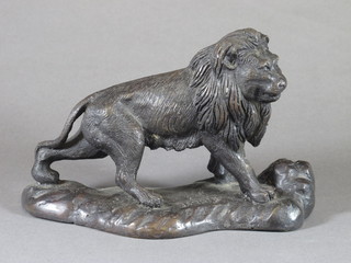 Barrie, a bronze figure of a walking lion 9"