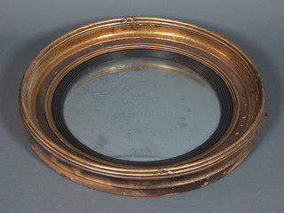 A 19th Century carved gilt wood circular convex wall mirror inset reeded ebony slip, 22.5"diameter