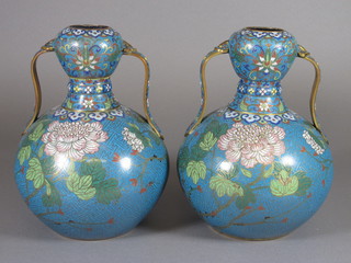 A handsome pair of Oriental turquoise ground and floral patterned twin handled cloisonne enamelled urns, 8", 1 slightly  bruised  ILLUSTRATED