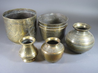 An Eastern engraved brass vase of stub form 6", 2 other Eastern brass vases 5" and 2 jardinieres