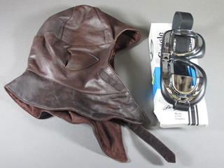 A modern leather flying helmet and a pair of Traspac model 1250 goggles