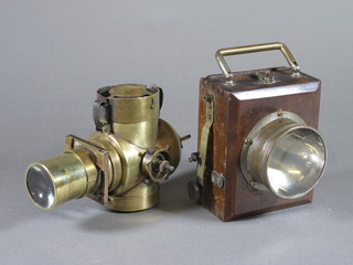 An early chrome and mahogany torch together with a brass cased projector?