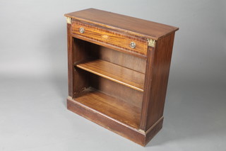 A George III style mahogany open dwarf bookcase, boxwood line inlaid, the frieze drawer centred with shell patterae above an  adjustable shelf and flanked by fluted pilasters, plinth base, 32"h  x 30"w