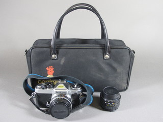 A Nikon 50mm 1:1.8 no.4346931 camera, a Nikon lens series E 28mm 1:2.8 1816188 lens together with 2 light meters