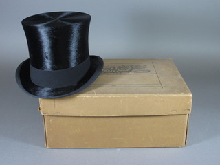 A gentleman's black silk top hat by Scotts & Co together with  cardboard box