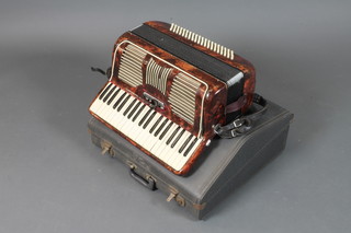A tortoiseshell coloured accordion with 120 buttons