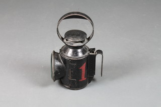 A railway style hand lantern, lens cracked