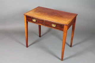 A 19th Century mahogany side table fitted 2 frieze drawers raised on square tapered legs 28.5"h x 32"w