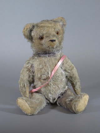 A purple mohair teddybear with articulated limbs, music box and  growler 15"