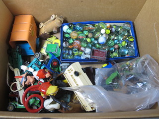 A collection of marbles and die cast vehicles etc