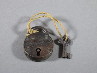 A circular padlock engraved an aircraft 1"