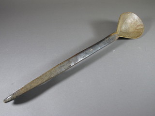 A 19th Century Swedish carved treen spoon with chamfered and  stylised carved decoration 22.5"l