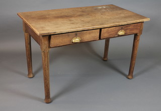 An early 20th Century oak writing table fitted 2 frieze drawers, raised on turned legs 29.5"h x 48"w x 27"d