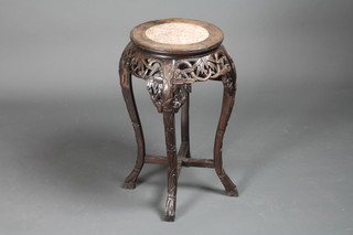 A Chinese circular pierced jardiniere stand with inset marble  panel to the centre 24"h x 12"diam