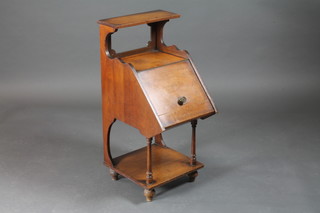 A Victorian walnut coal purdonium with hinged lid, raised on  turned supports with undertier 13"w x 17"d x 31"h