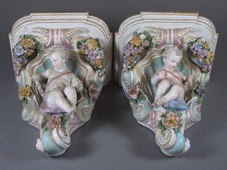 A pair of late 19th Century Samson porcelain wall brackets decorated cherubs  9" in the Meissen taste  ILLUSTRATED