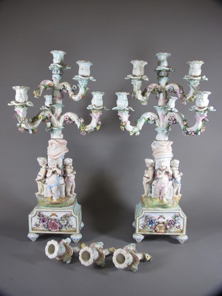 A pair of 19th Century Meissen style 5 branch candelabrum  supported by cherubs 24", heavily f,